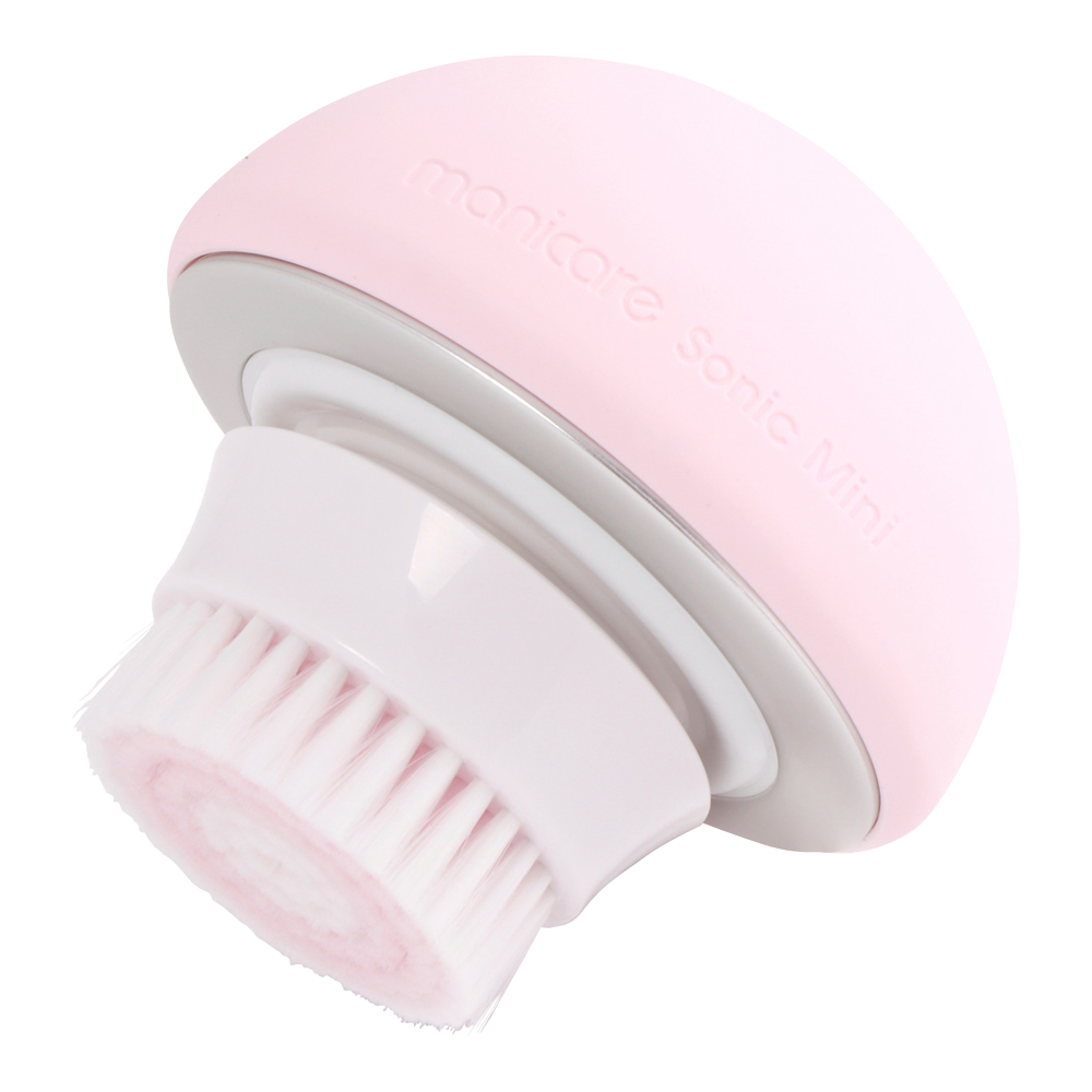 Side profile of Manicare Sonic Mini rechargeable facial cleansing brush with ergonomic handle and waterproof brush head