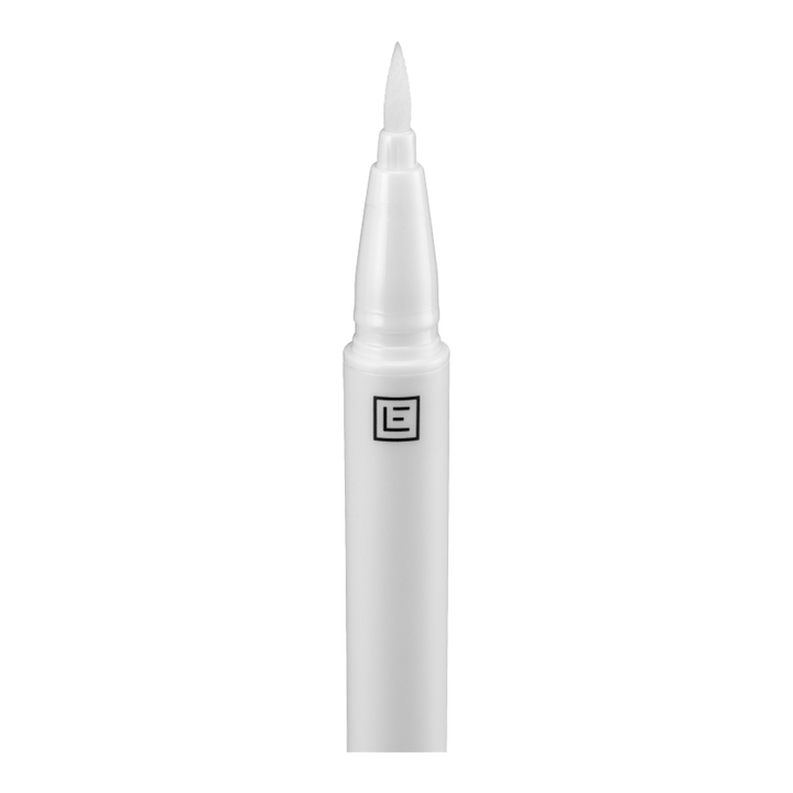 Eylure Line & Lash 2-in-1 Adhesive Eyeliner Clear applicator closeup – precision felt tip lays adhesive lash line, Blush Fiji